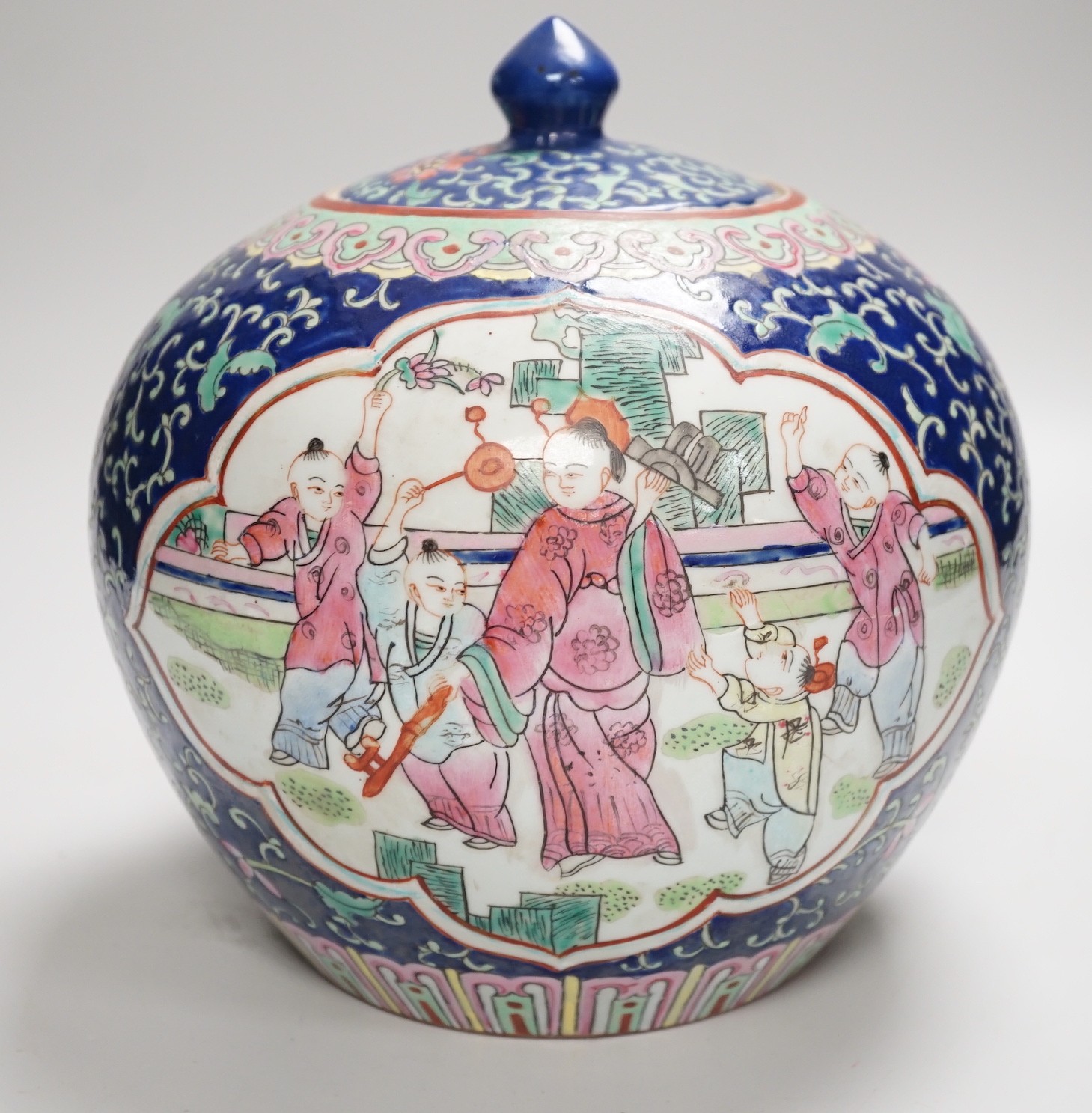 A Chinese famille rose jar and cover, 20cm high